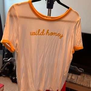 White graphic t-shirt with gold trim